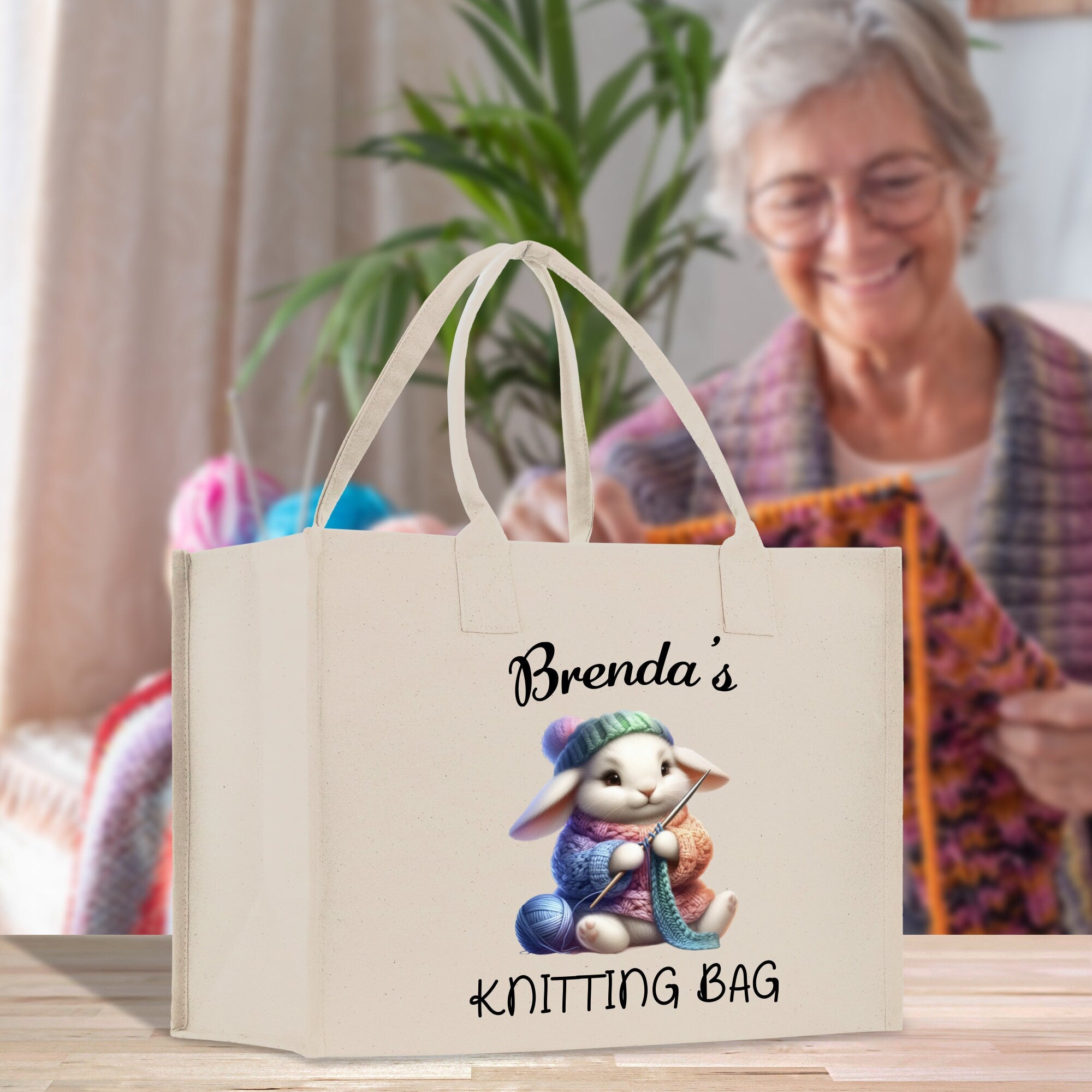 a woman sitting at a table with a bag