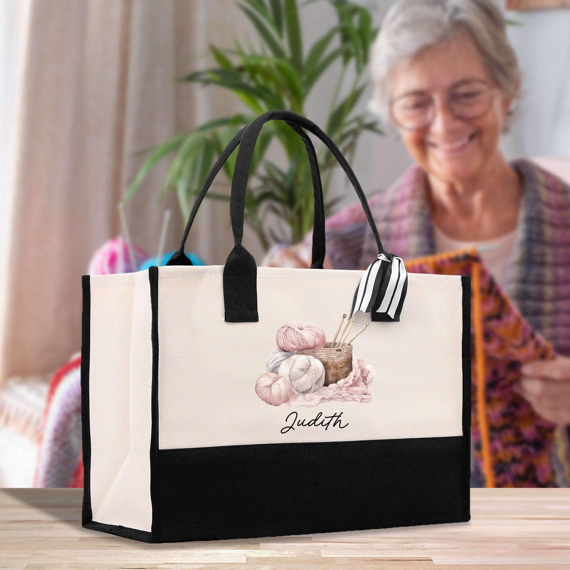 a woman sitting at a table with a bag