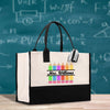 a black and white bag with a chalkboard in the background