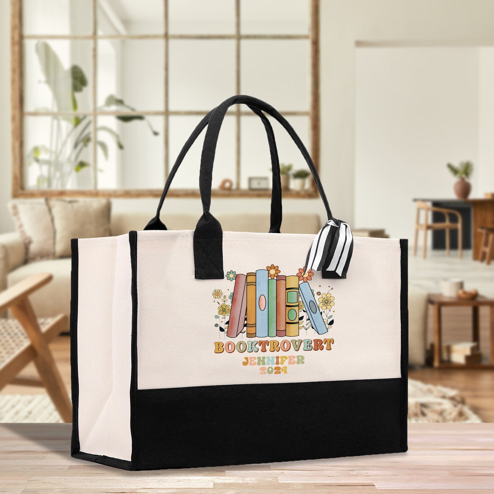 a white and black bag sitting on top of a wooden table