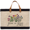 a canvas bag with flowers and butterflies on it