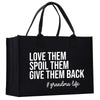 a black shopping bag with white words on it