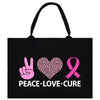 a black bag with a pink heart and peace - love - cure on it