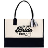 a black and white tote bag with the words in my bride era on it