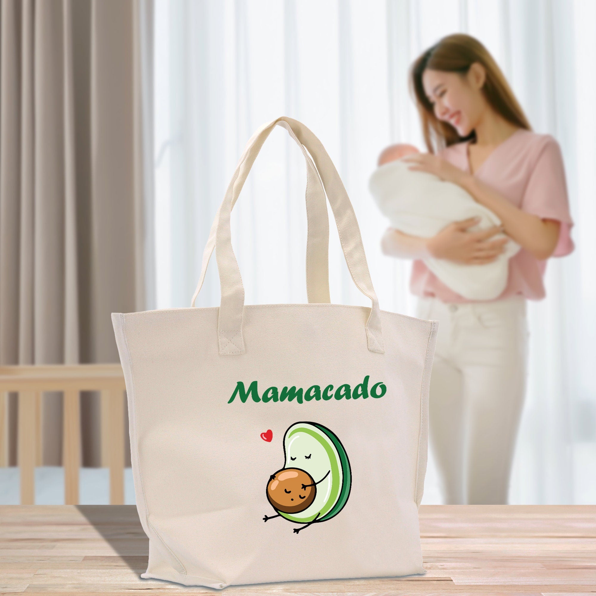 a woman holding a baby in a white bag