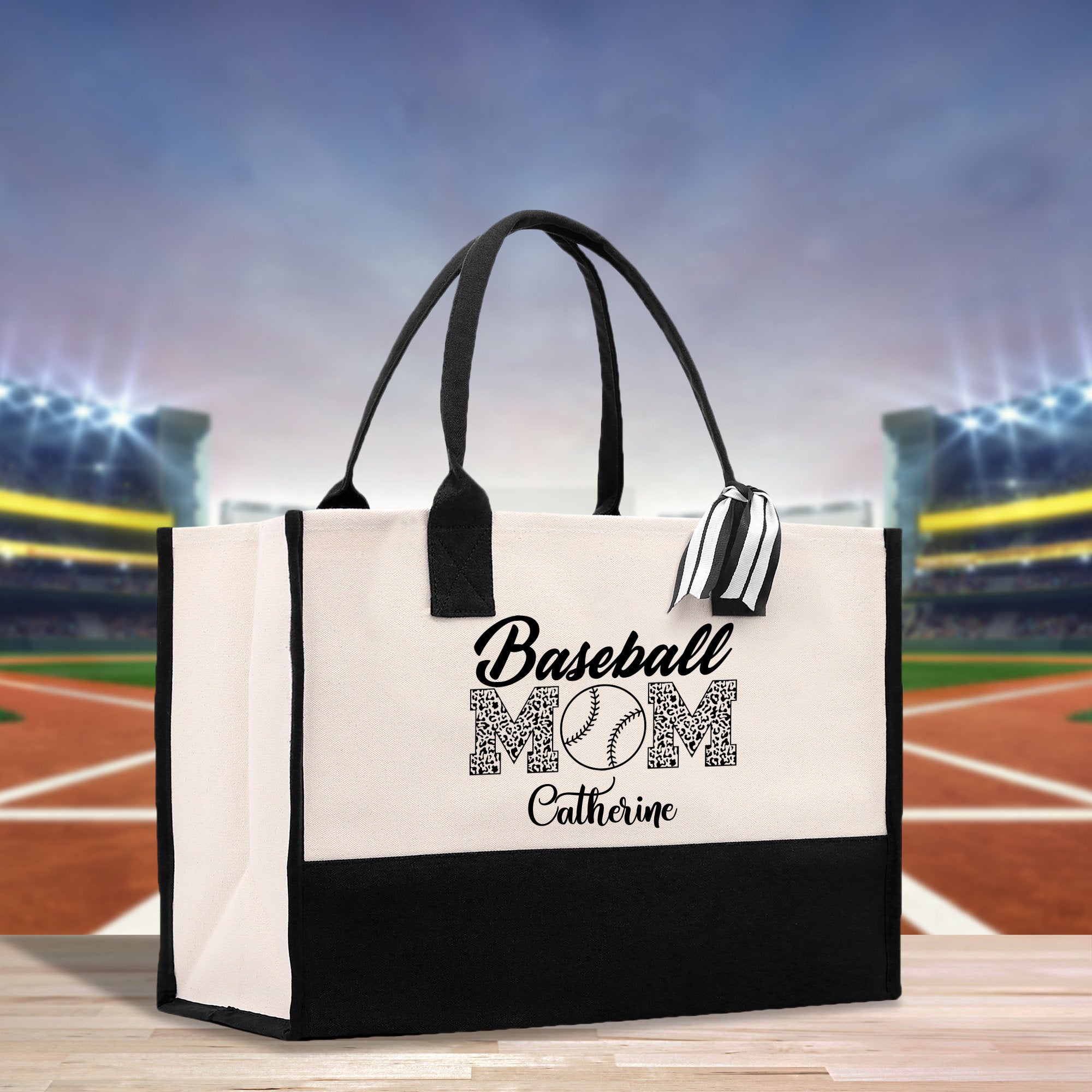 a black and white bag with a baseball mom on it