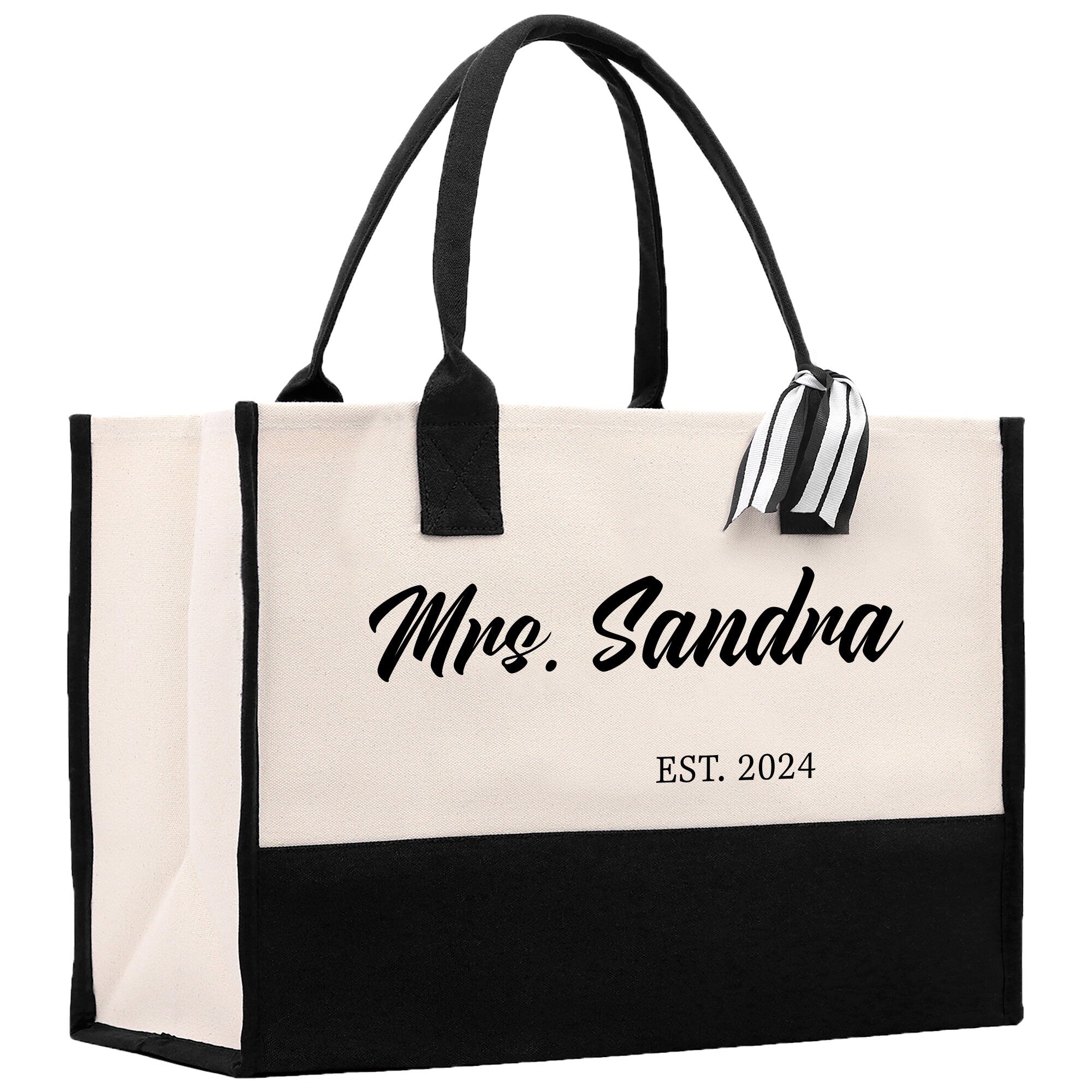 a black and white bag with a name on it