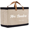 a canvas tote bag with a leather handle