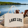 a lake life shopping bag sitting on a dock
