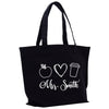 a black tote bag with a heart and a coffee cup