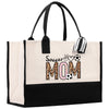 a black and white tote bag with a soccer mom on it