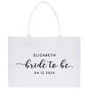 a white tote bag with the words bride to be printed on it