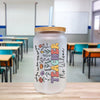 a glass jar with a straw in the middle of a classroom