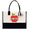 a black and white bag with a red apple on it