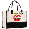 a white and black bag with a red apple on it
