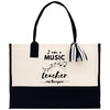 a black and white bag with a music teacher on it