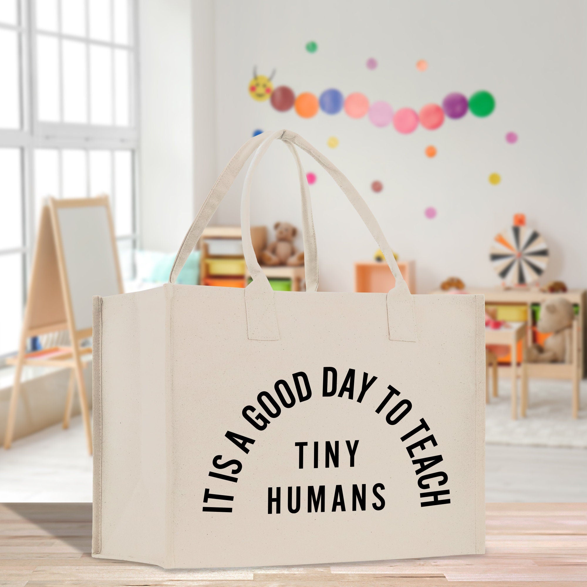 a bag that says it&#39;s a good day toteh tiny humans