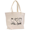 a tote bag with a picture of an apple, a cup, and a