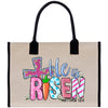 a bag with the words little is risen printed on it