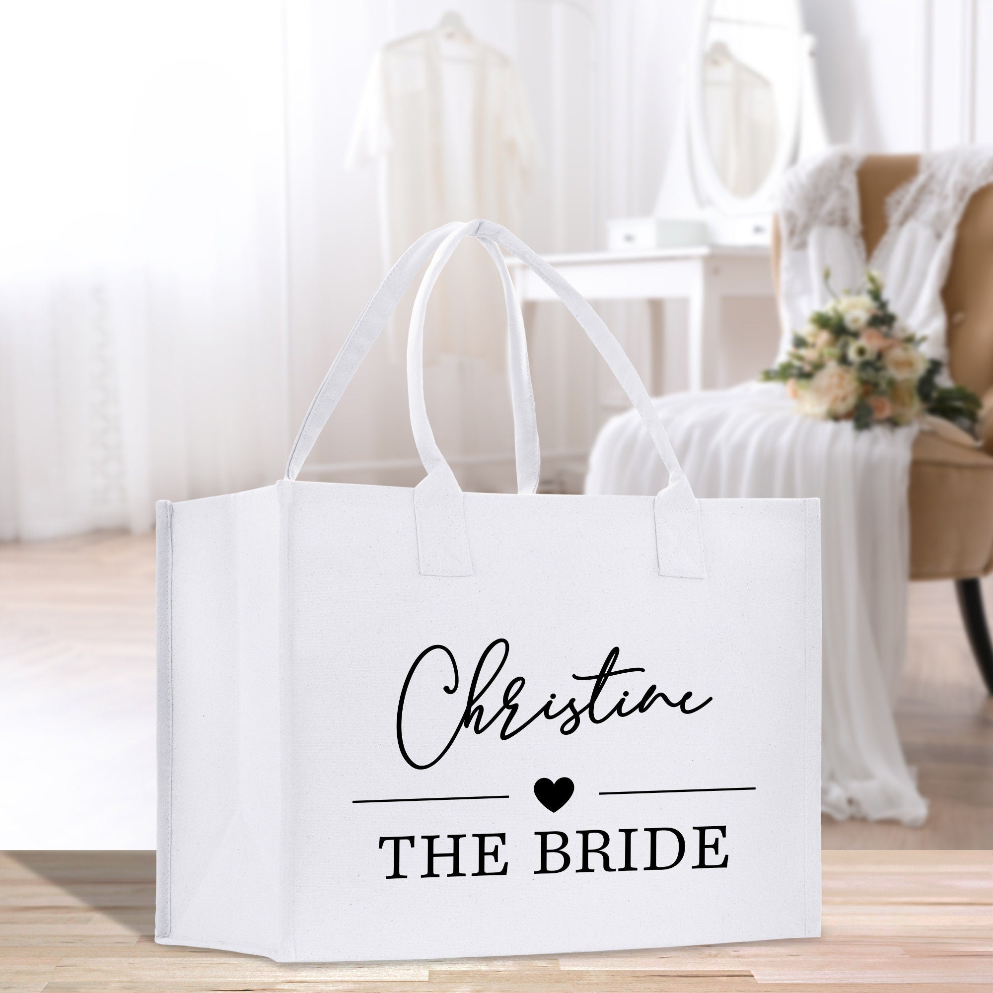 a white bag that says christian the bride
