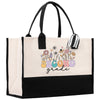 a black and white tote bag with a flower design