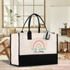 a black and white bag with a rainbow on it