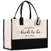 a black and white tote bag with a name on it