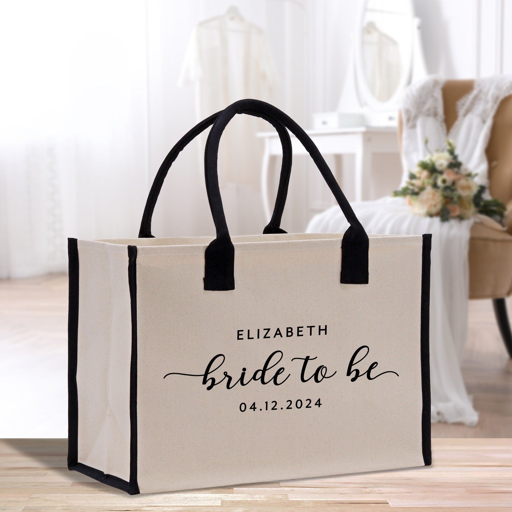 a bride to be bag sitting on a wooden floor