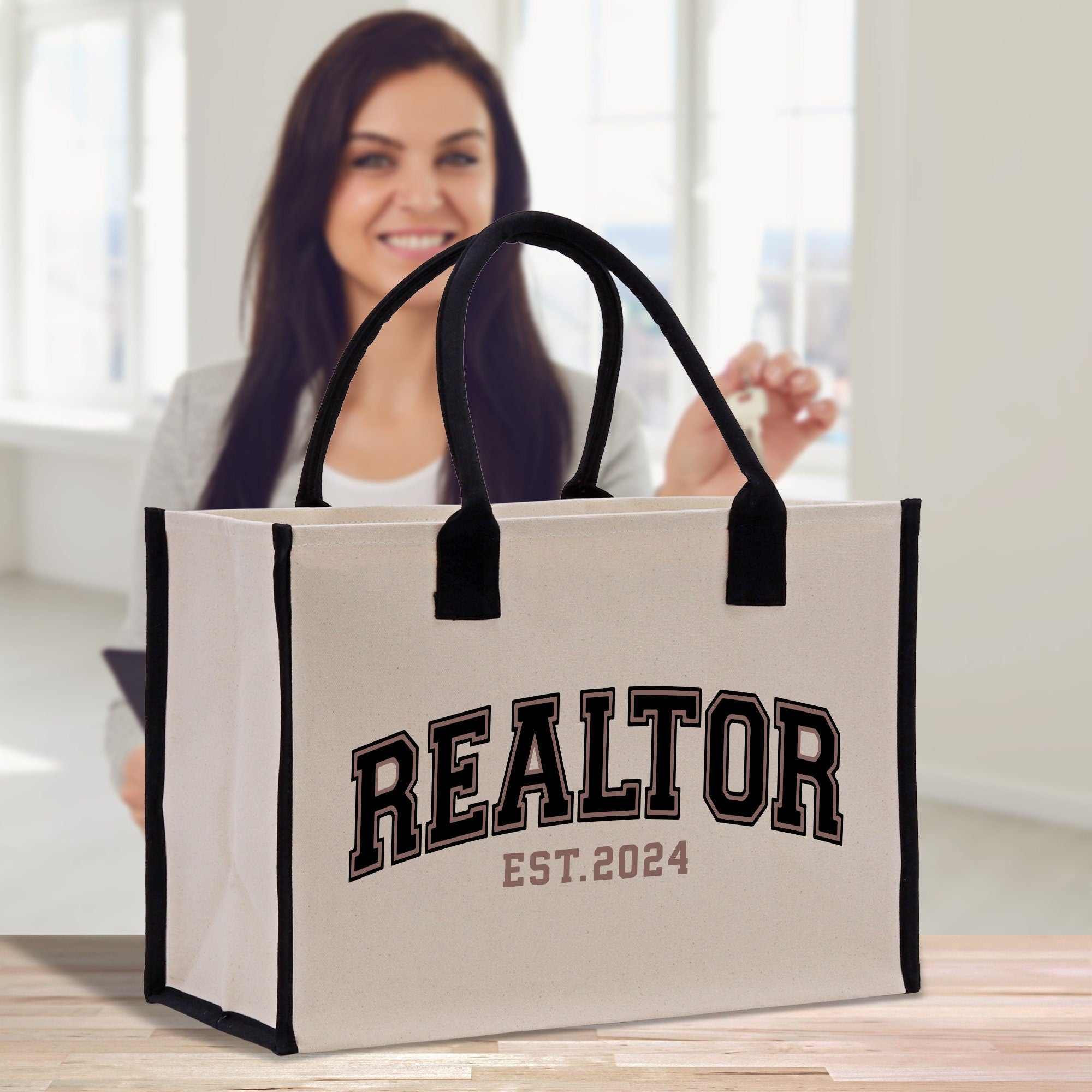 a woman is holding a realtor shopping bag
