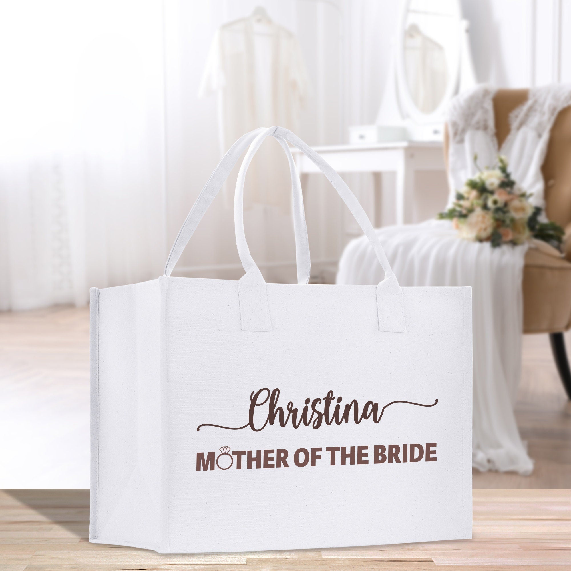 a mother of the bride bag sitting on the floor