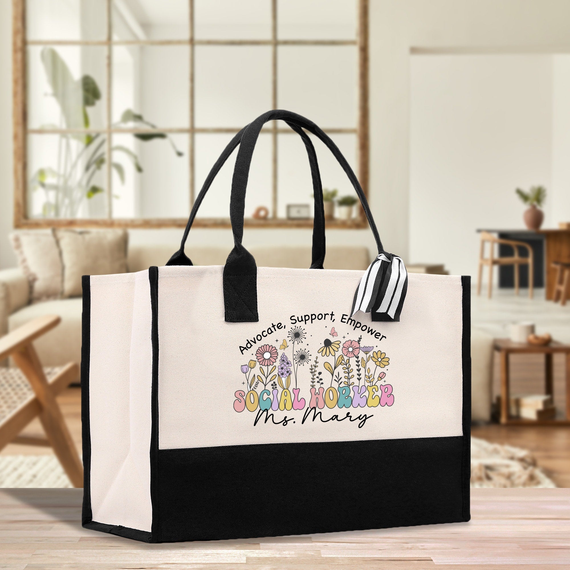 a black and white shopping bag with cartoon characters on it