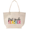a white bag with the words first grade teacher on it