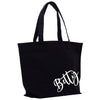 a black tote bag with white letters on it