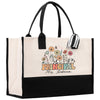 a black and white shopping bag with a flower design
