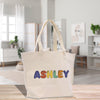 a white bag with the word ashley printed on it