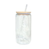 a glass jar with a straw in it