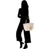 a silhouette of a woman with a handbag