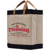 a jute bag with a black bottom and brown handles