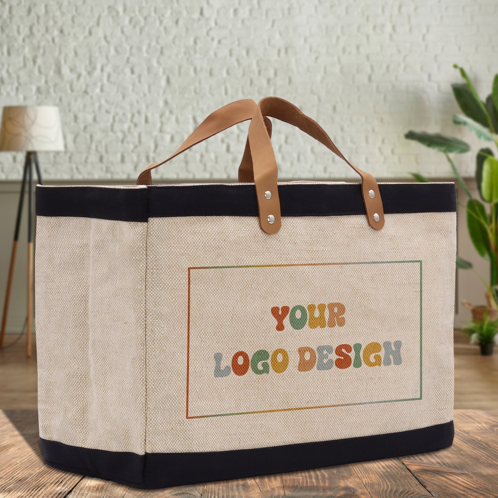 a canvas bag with a leather handle on a wooden table