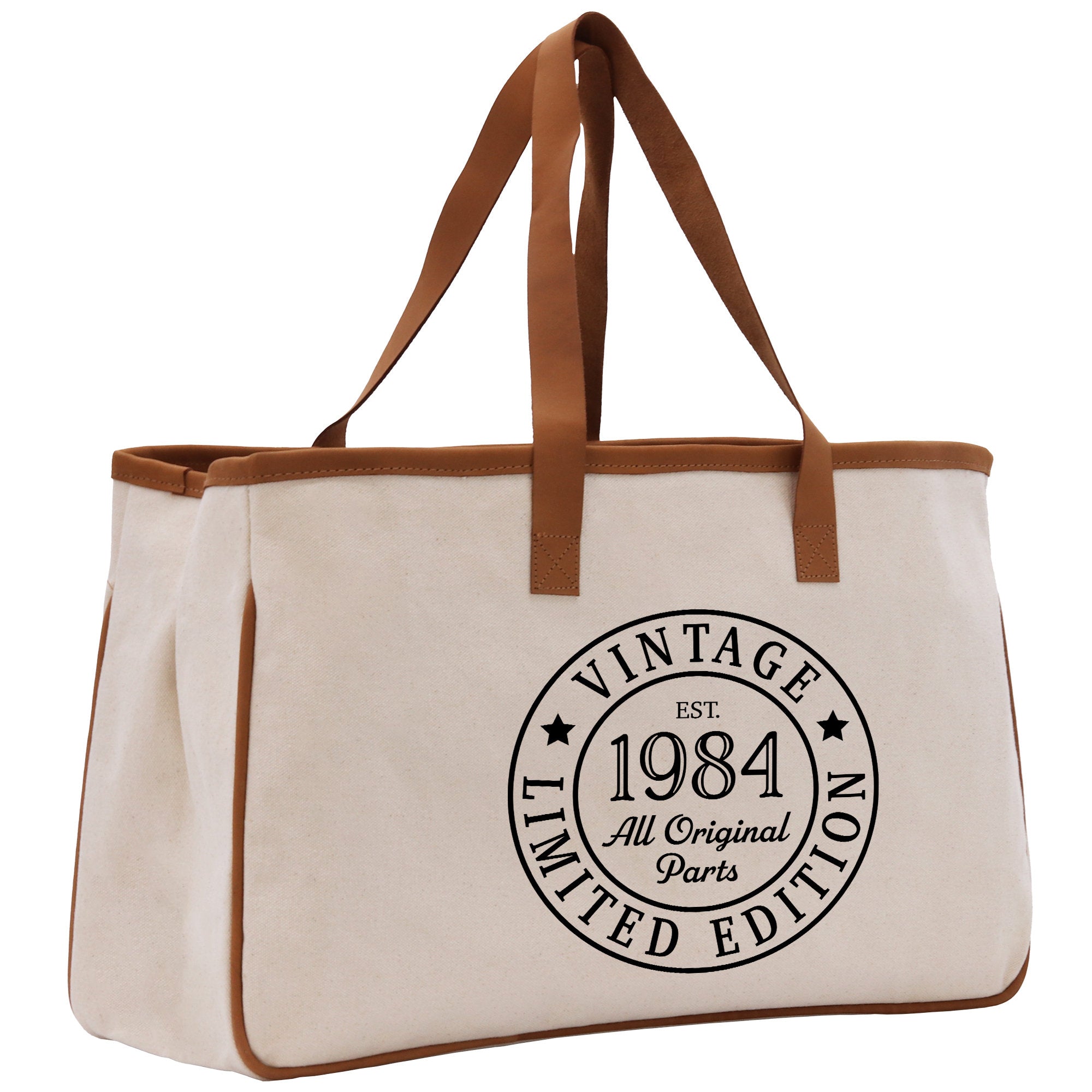 a large white bag with a brown leather handle