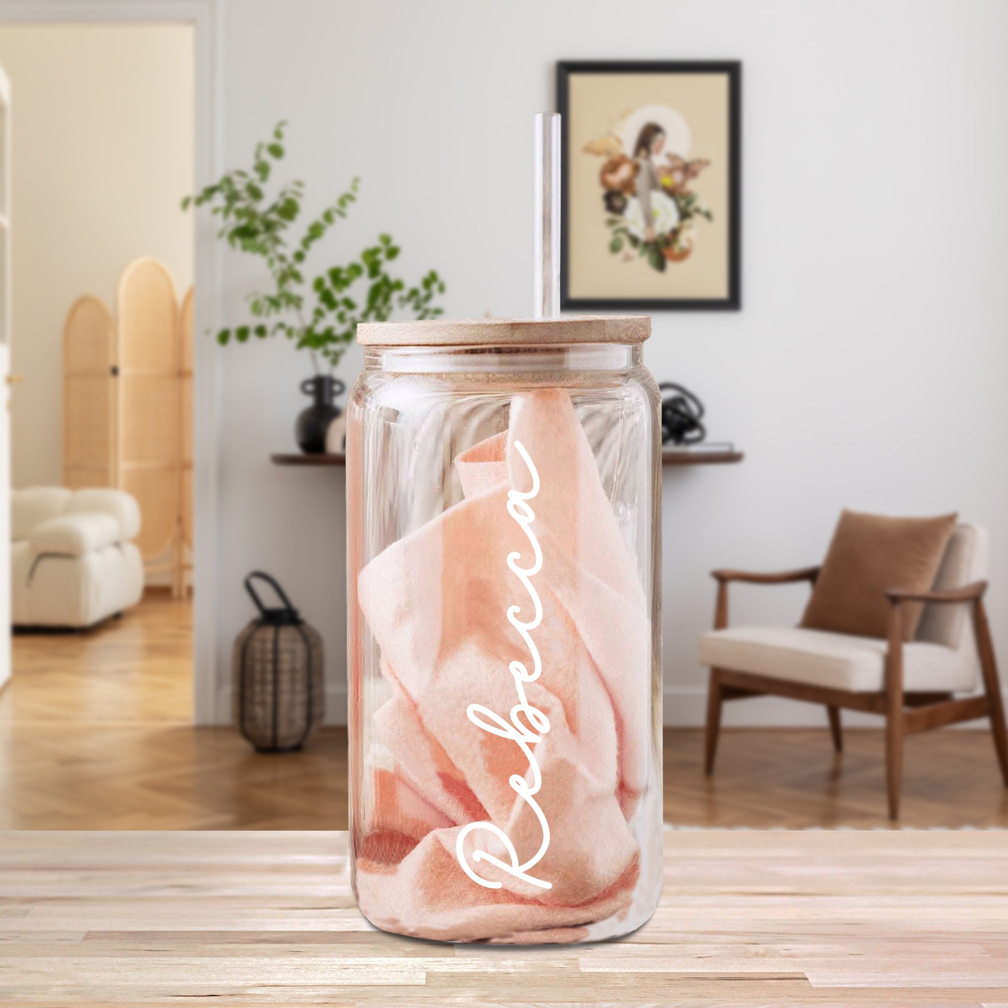 a glass jar with a pink cloth inside of it