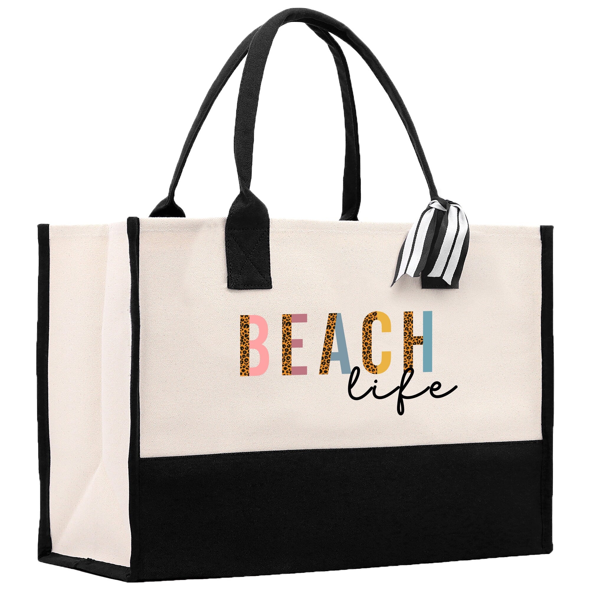 a white and black beach bag with a black handle