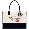 a black and white bag with a red lipstick on it