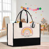 a black and white bag with a rainbow on it