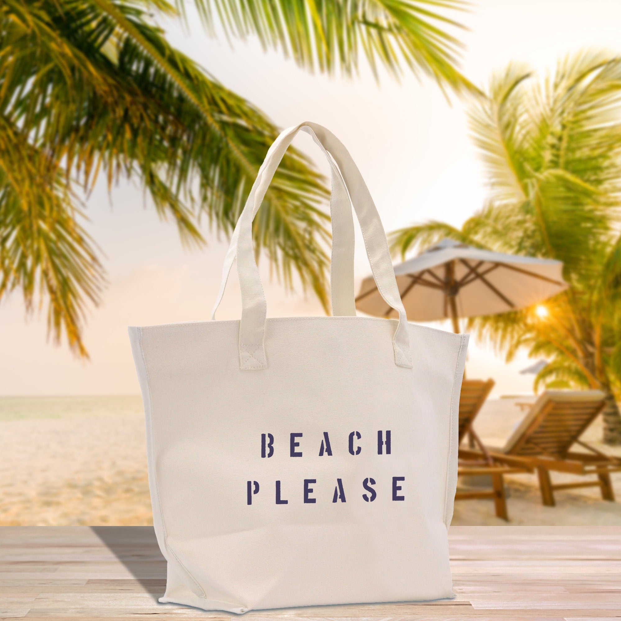 a white beach bag sitting on top of a wooden table