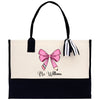 a black and white bag with a pink bow on it