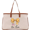 a white bag with a yellow bow on it