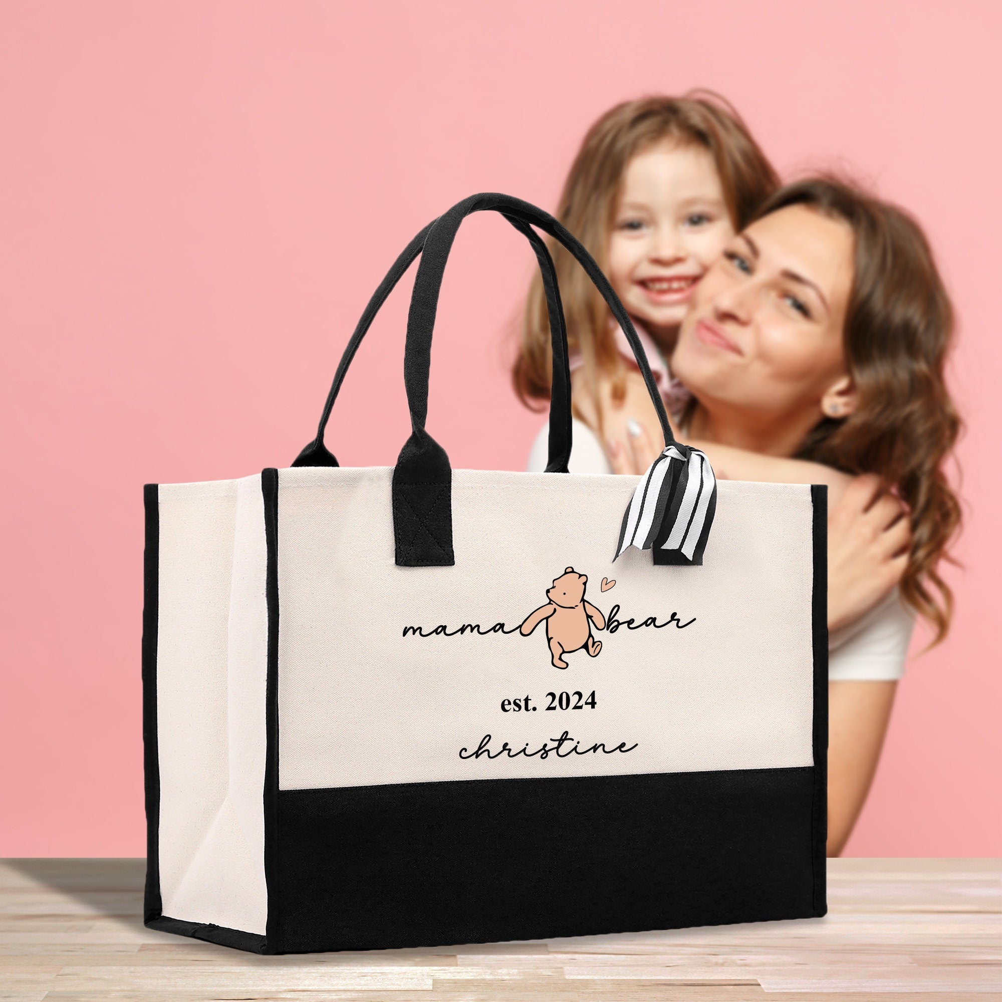 a woman holding a child in front of a bag