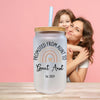 a woman hugging her friend with a personalized mason jar