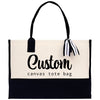 a black and white tote bag with a black and white ribbon